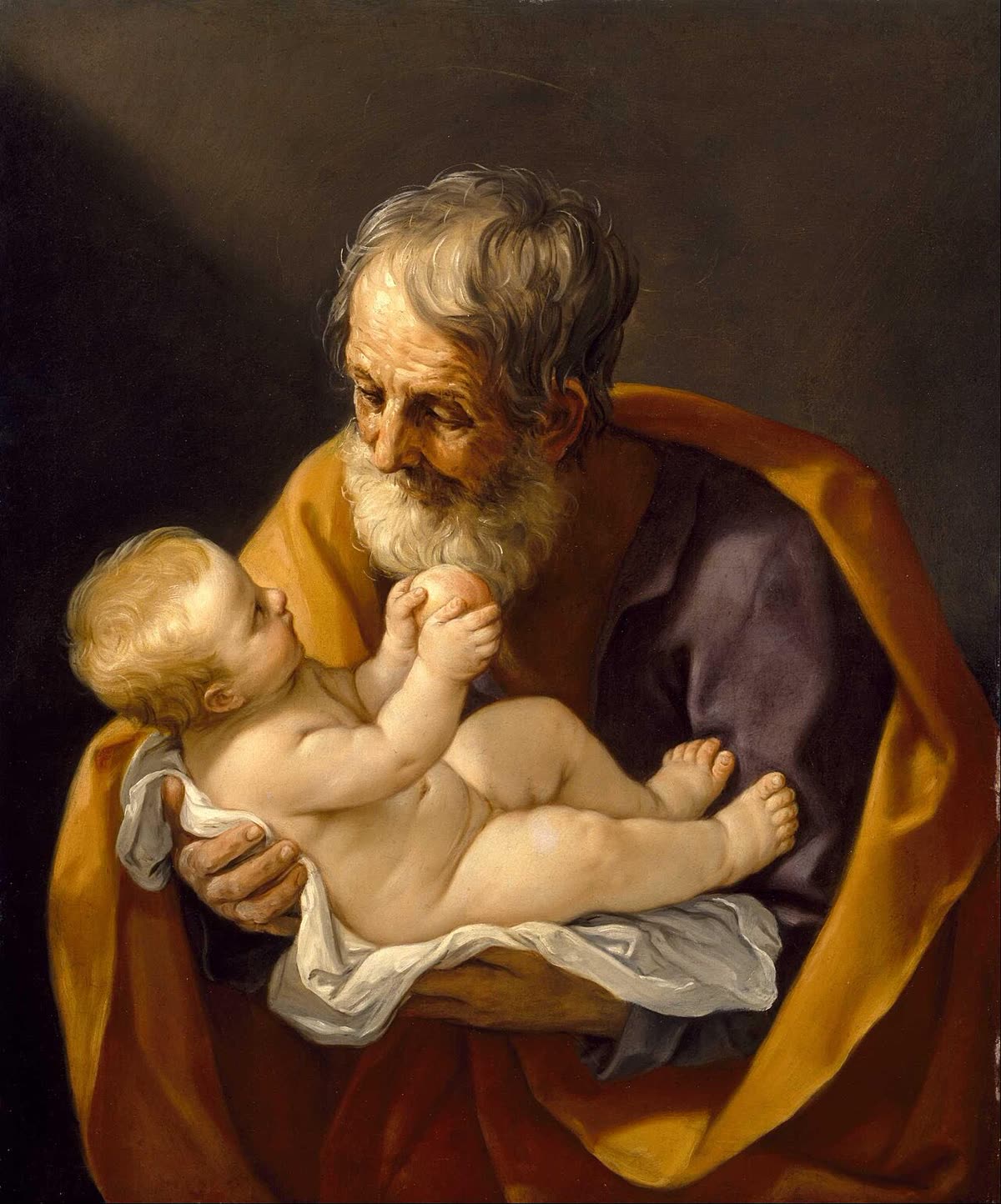 Painting of St. Joseph, a bearded man in a golden robe, cradling and gazing down at the infant Jesus.